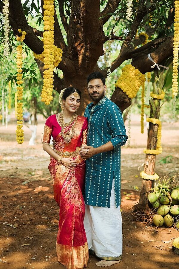 South Indian couple under a decorated tree